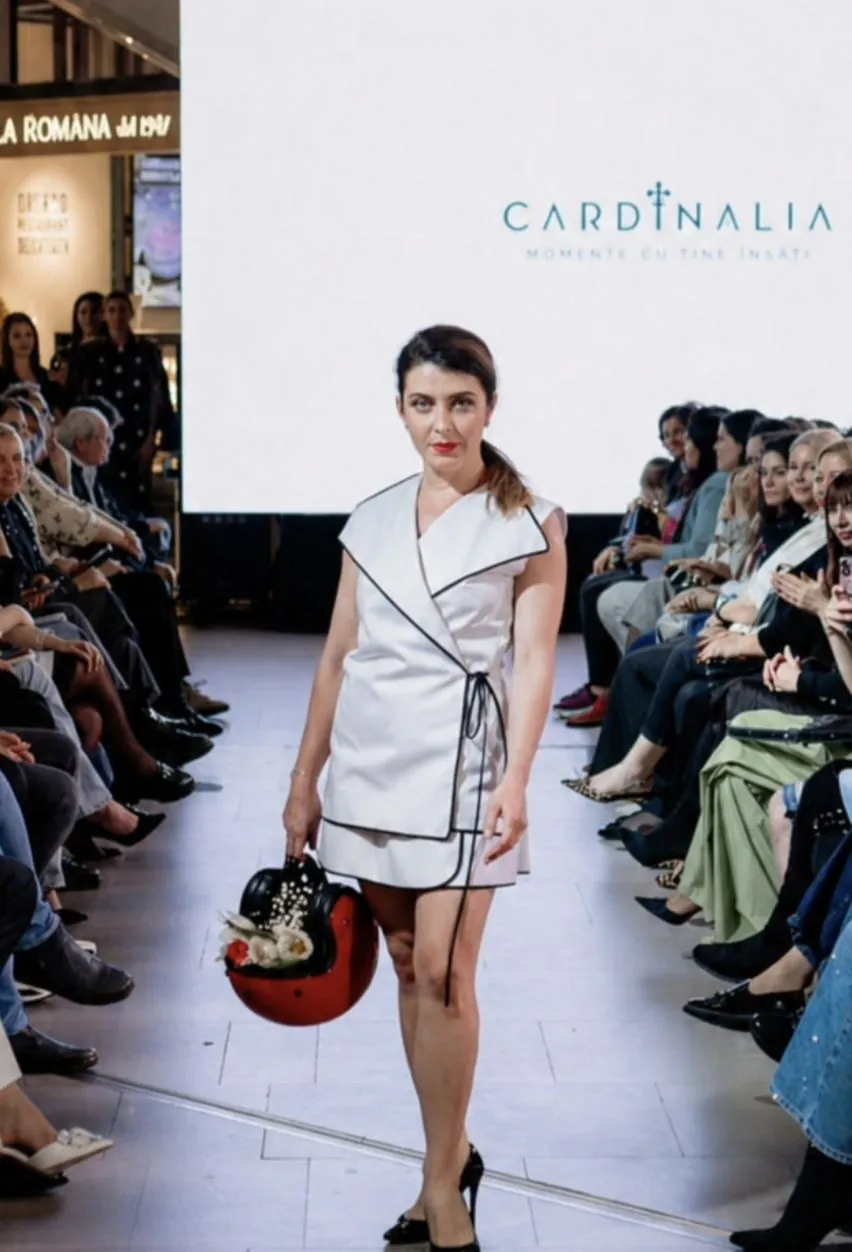 White asymmetric-cut outfit, presented at Cardinalia